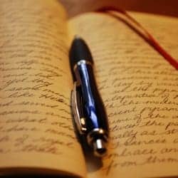 written journal and pen photo