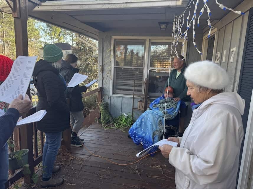choir caroling to members